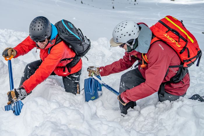 Digging to save a life: Strategic shoveling for a backcountry rescue scenario