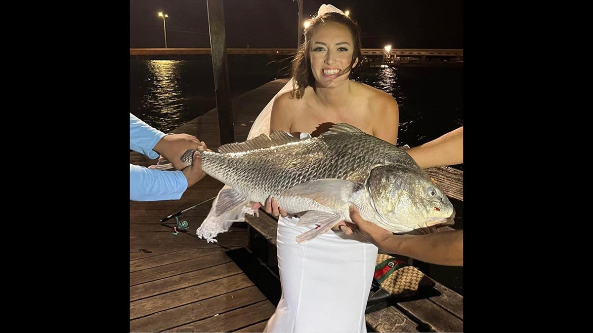 Woman Catches Personal Best Fish on Wedding Night